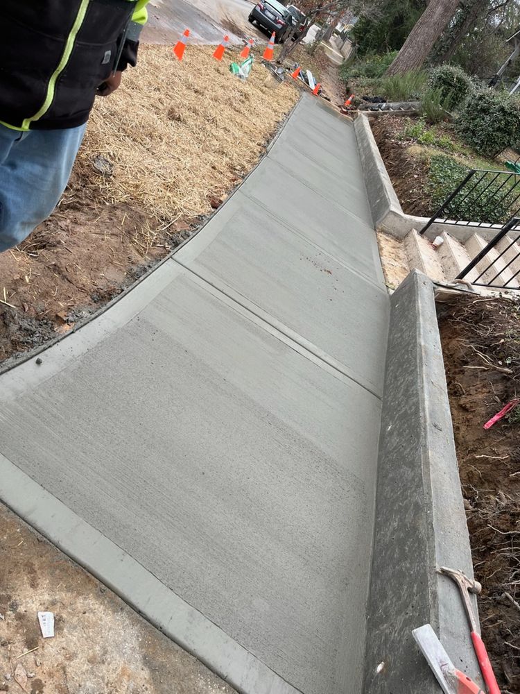 Our retaining wall construction service enhances your landscape's functionality and aesthetic, providing sturdy, durable solutions to prevent soil erosion and manage sloping terrain for a long-lasting outdoor transformation. for DH Construction & Concrete in Roebuck, SC