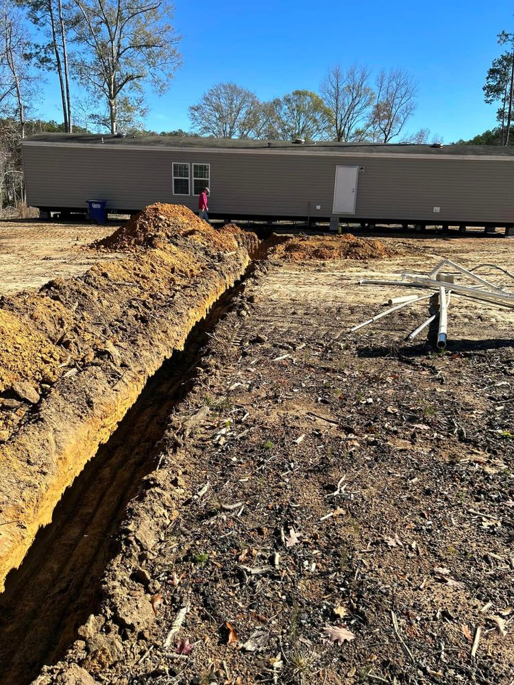 Our professional team specializes in septic tank installation, maintenance, and repair for homeowners looking to improve their property's waste management system. Trust us to handle all your septic needs efficiently. for Kountry Construction in Brookhaven, MS