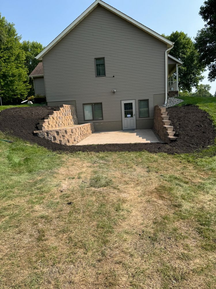 Our retaining wall construction service enhances your landscape by preventing soil erosion, improving drainage, and adding visual appeal, creating a sturdy and attractive boundary tailored specifically to your property's needs. for Wurm Lawn and Landscape in Maple Lake, MN