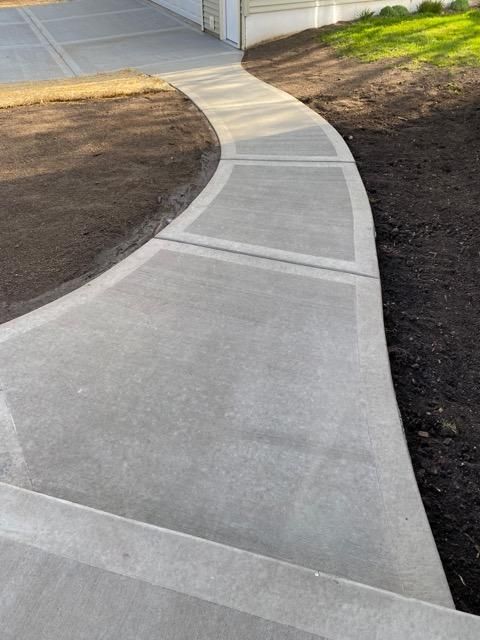 Our Sidewalk Installation service offers durable, aesthetically pleasing sidewalks customized to fit your home's style. We prioritize quality craftsmanship and use premium materials to ensure a long-lasting, safe walking surface for you and your family. for Martinez Concrete Services in McDonough, GA