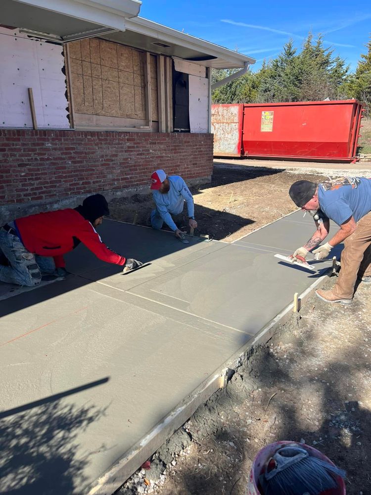 Enhance your home's curb appeal and functionality with our professional Sidewalk Installation service. Our experienced team will expertly install durable and visually appealing sidewalks to improve your property. for Travis Hill Concrete & Construction in Topeka, KS