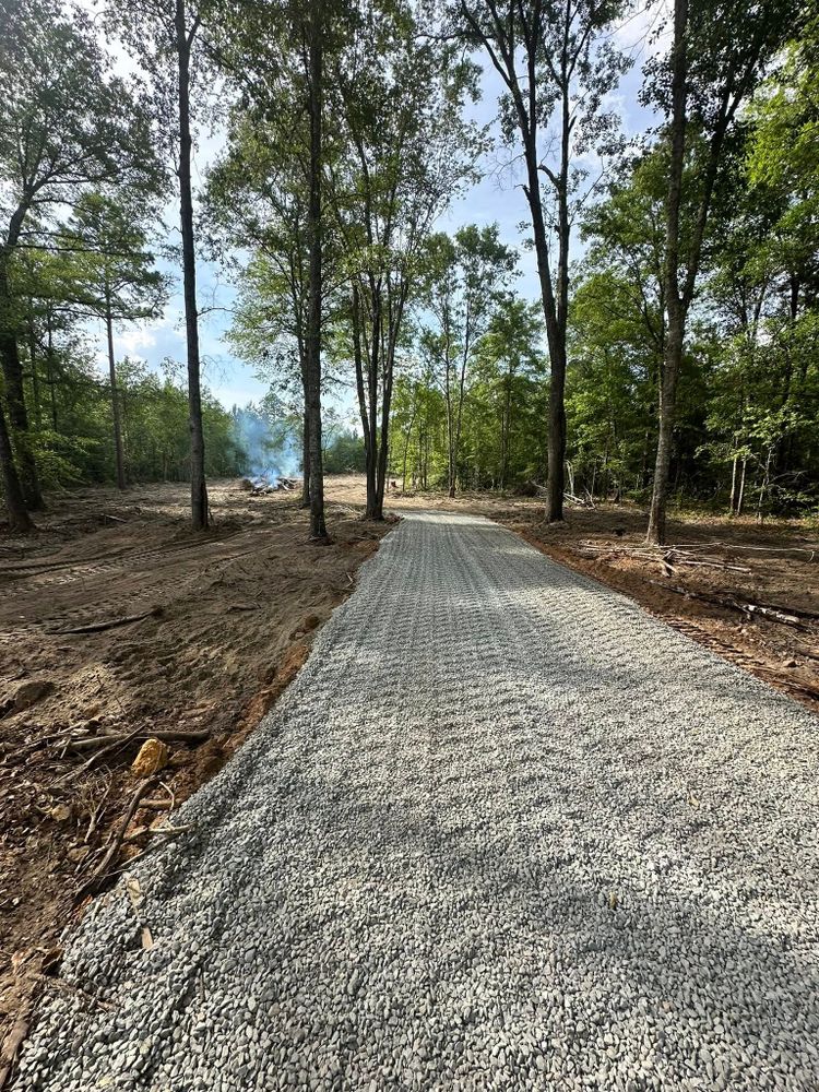 Enhance your home's curb appeal with our expert Install & Repair Driveways service. Our skilled team ensures durable, aesthetically pleasing driveways, using top-quality materials tailored to complement your landscape design. for Page Outdoor Services in Wrightsville, GA
