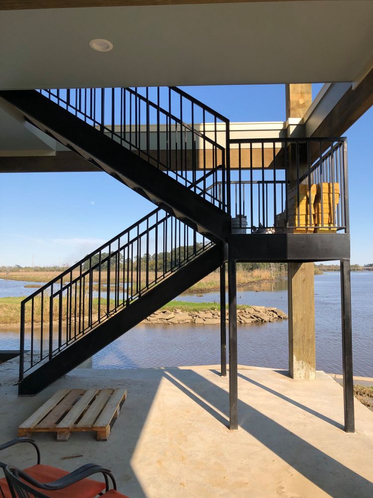 Transform your home with our custom stair design and installation service, offering durable and stylish metal solutions tailored to fit your space, ensuring quality craftsmanship and exceptional aesthetic appeal. for Aluminum & Iron Works in Lake Charles, LA