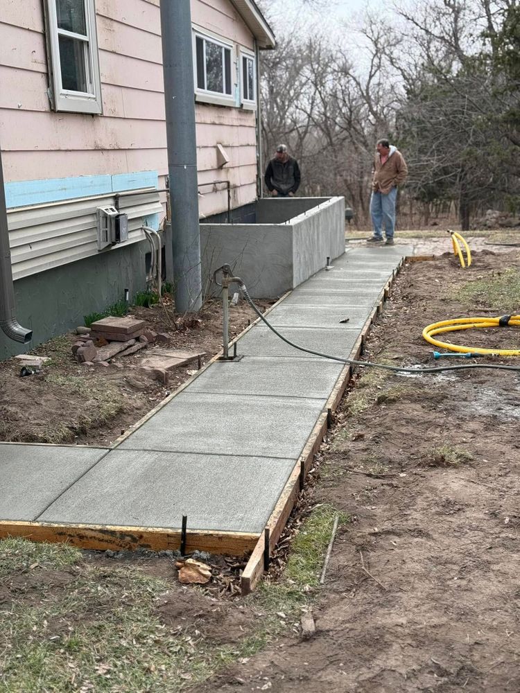 Enhance your home's appeal with our expert sidewalk installation services. We provide durable, aesthetically pleasing sidewalks that complement your property's design while ensuring safety and long-lasting performance for years to come. for TC Concrete in Elk City, OK