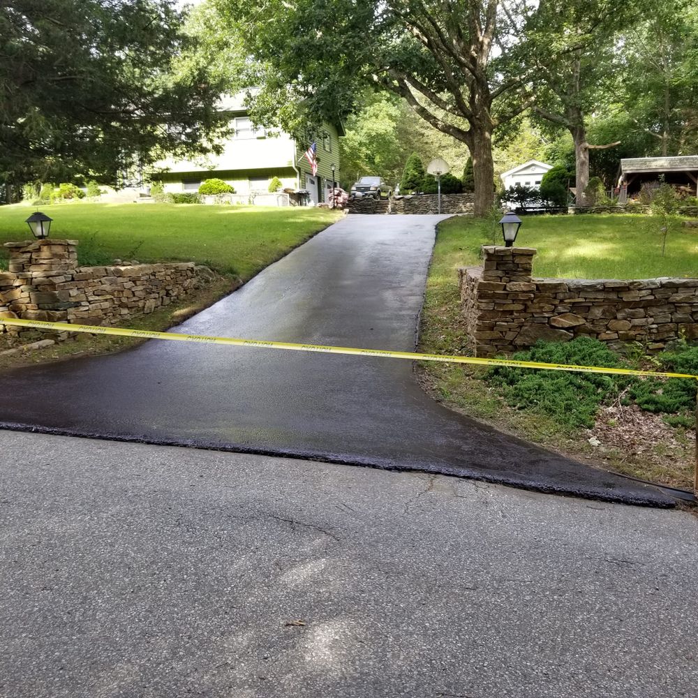 Enhance your driveway's lifespan with our professional seal coating service, providing a protective layer that prevents damage from weather, oils, and traffic while maintaining its appearance and integrity. for AM Sealers in Griswold, CT