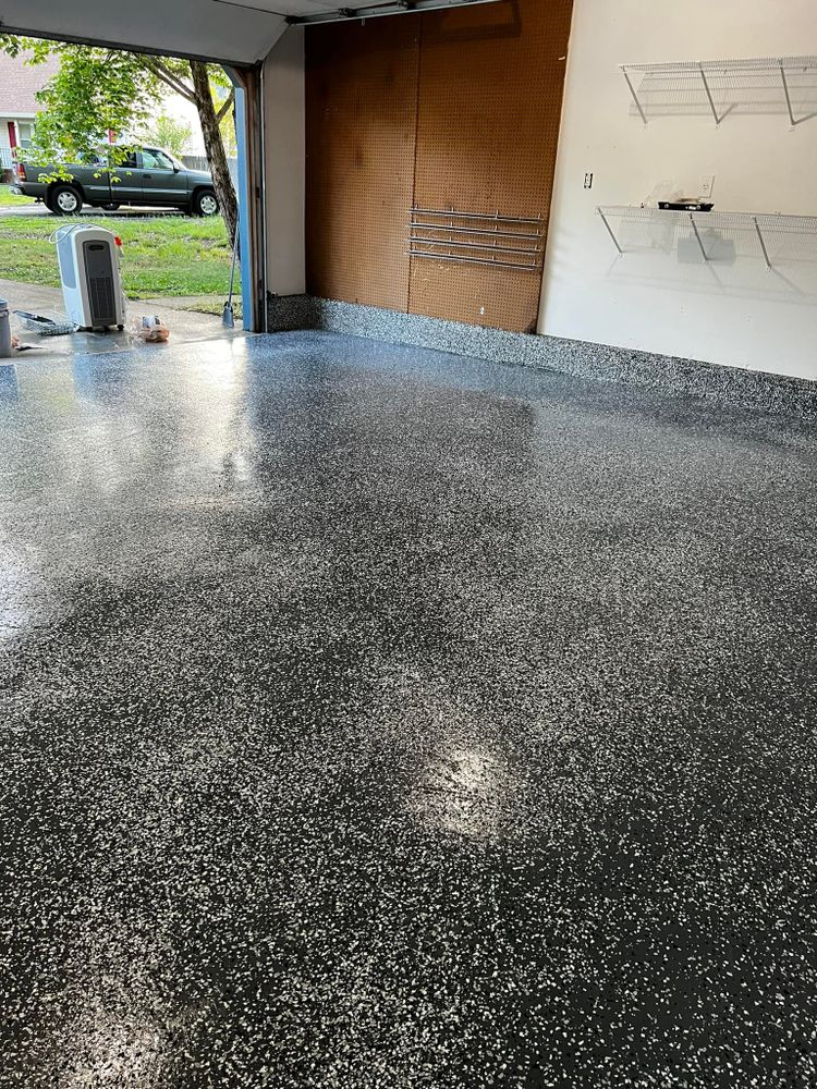 Transform your floors with our durable epoxy coating service, providing a seamless, high-gloss finish that enhances aesthetics and protects surfaces from stains, chemicals, and wear in your home. for Costa Painting in Suffolk, VA