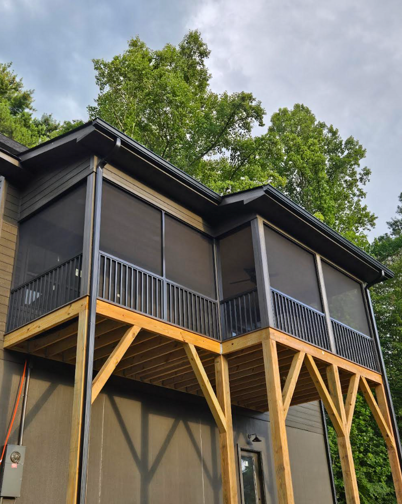 Enhance your outdoor living space with our expertly designed screen porches, offering protection from insects and weather while providing a comfortable area to enjoy beautiful views in any season. for C4 TrueVision Renovations in Asheville, NC