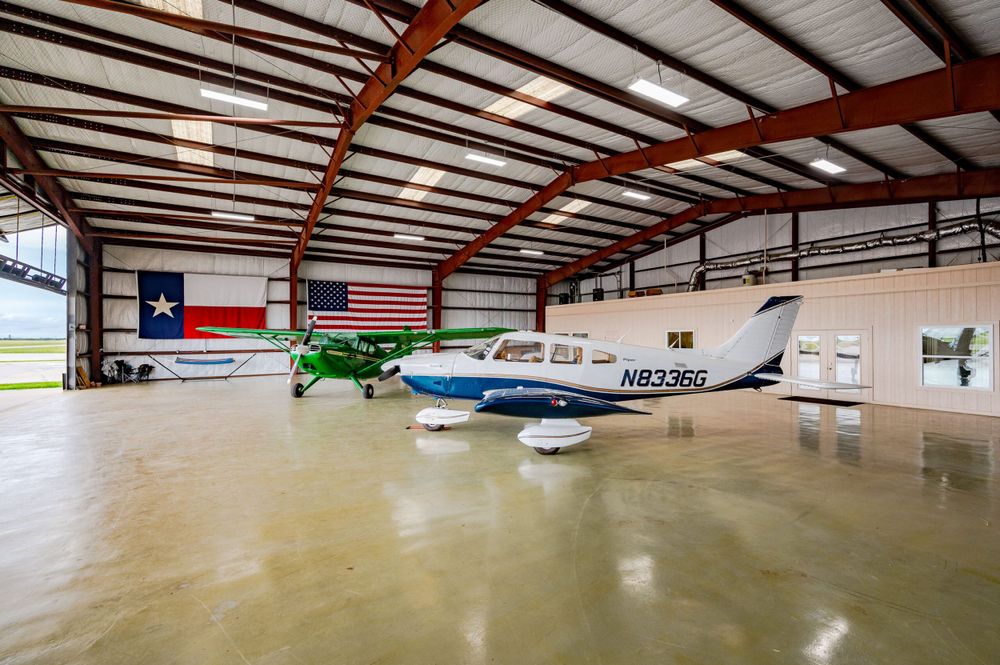 Our Aircraft Hangars service provides homeowners with secure and spacious storage solutions for their private planes, ensuring safe keeping and easy accessibility for aviation enthusiasts within our new developments. for K&L Construction in Milledgeville, GA