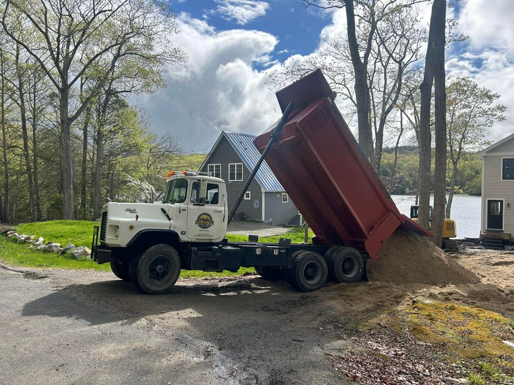 Our material hauling service efficiently transports necessary materials to customers and job sites . As well as debris removal. for DArcy  Cleveland & Sons Excavation LLC in Pawcatuck, CT