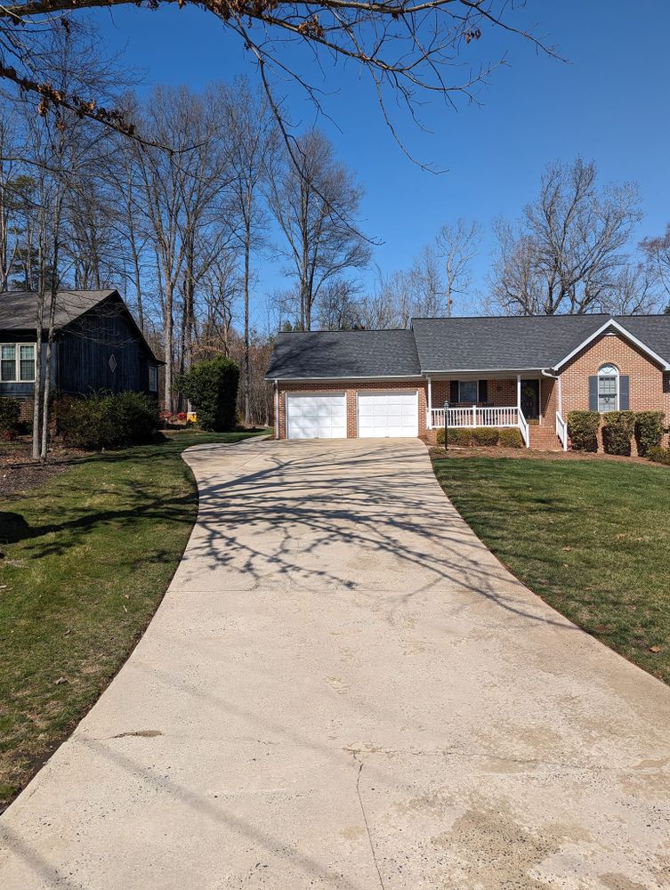 Our Concrete Cleaning service effectively removes dirt, stains, and grime from your driveway, patio, or sidewalks using high-pressure washing techniques for a pristine finish that enhances the appearance of your home. for Precision Pressure and Soft Washing LLC in Albemarle, NC