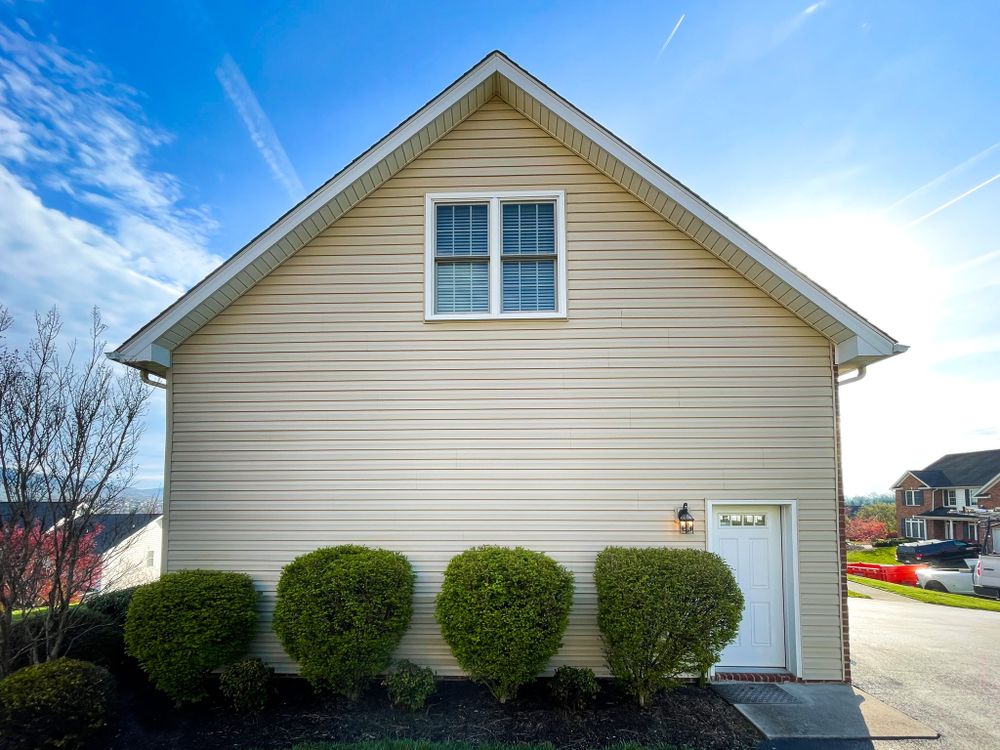 Soft house washing uses a gentle, low-pressure water technique combined with specialized solutions to remove dirt, grime, mold, algae, and organic stains from house exteriors, safeguarding your exterior from potential high-pressure damage. for Elite Wash LLC in Roanoke, VA