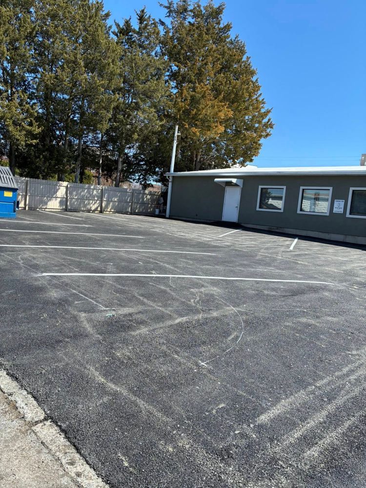 Our parking lot construction service designs and builds durable, smooth asphalt lots with proper grading, drainage, and striping, delivering safe access, lasting performance, and strong curb appeal for your property. for Chris Asphalt & Sealcoating in Allentown, PA