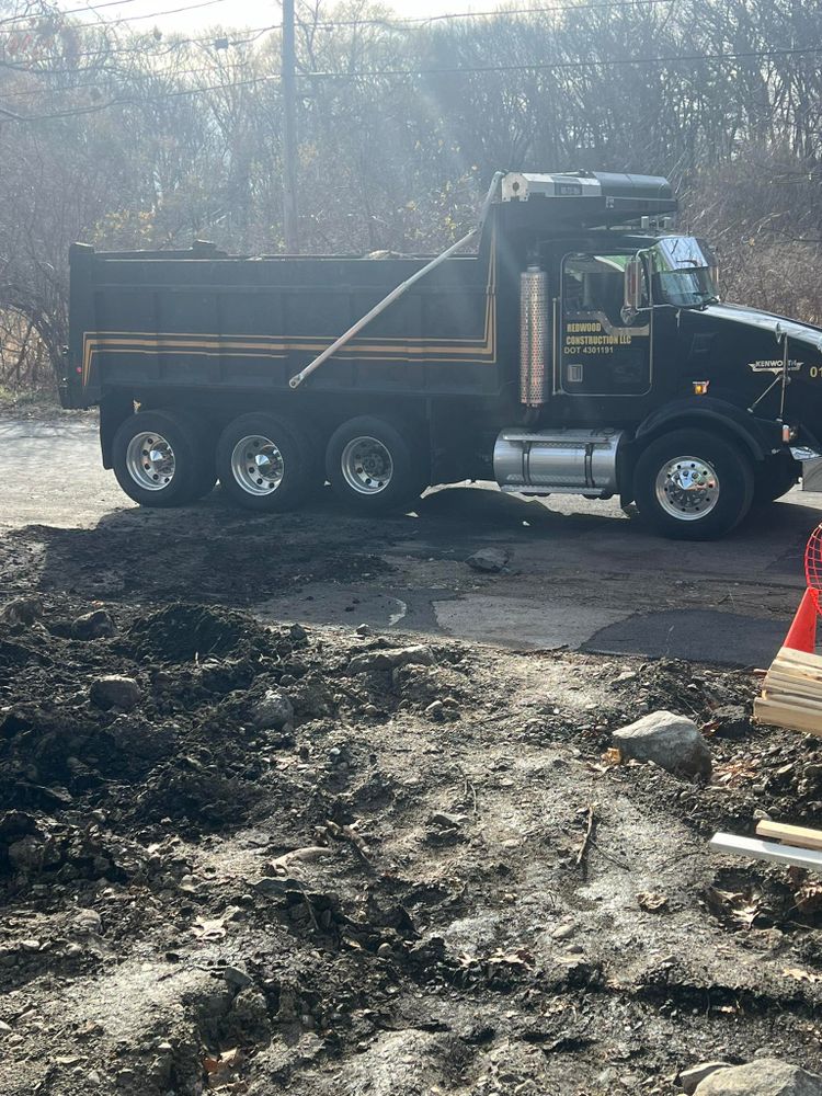 Our hauling services remove soil, rock, debris, and materials quickly and safely from your property. We support excavation projects with reliable transport, clean worksites, timely service, and professional care. for Redwood Construction in Cranston, RI