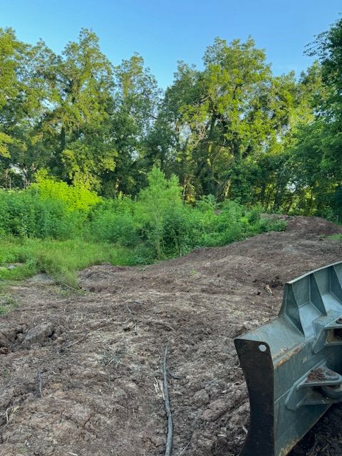 Our Clearing and Grubbing service efficiently removes unwanted vegetation and debris, preparing your site for flawless concrete installation, ensuring a clean slate for construction while enhancing the overall stability of your project. for Divine Construction Services in Brazoria County, TX