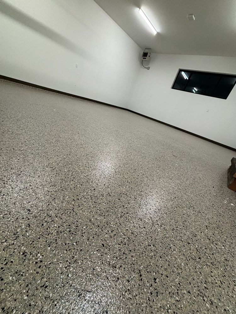 Our professional epoxy floor coating service transforms spaces with durable, high-gloss finishes. Ideal for any homeowner seeking a seamless look, it pairs beautifully with vinyl elements to enhance aesthetic appeal and functionality. for Grand Painting in Bozeman, MT