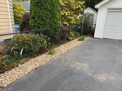 Our River Rock Installation service gives your lawn a beautiful, natural look with minimal maintenance. It's an easy way to enhance the aesthetic of your outdoor space. for Bumblebee Lawn Care LLC in Albany, New York