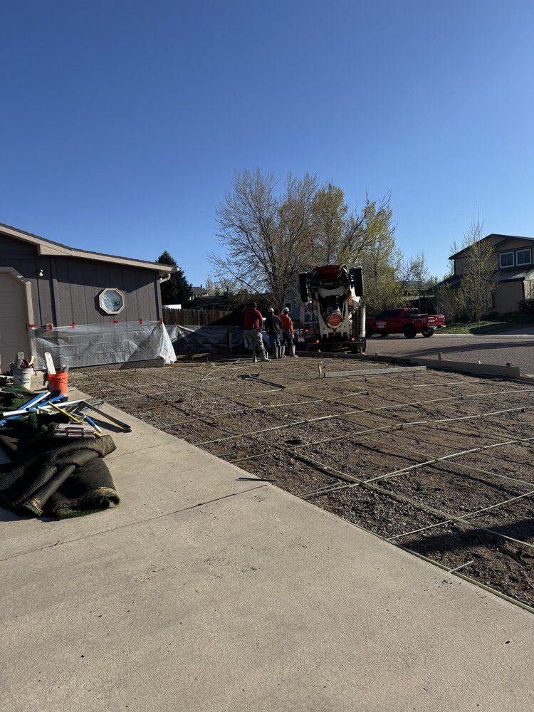 Our driveway construction service delivers durable and aesthetically pleasing driveways through expert concrete slab construction, ensuring long-lasting quality and enhancing your home's curb appeal with precision craftsmanship. for Majestic Custom Concrete in Colorado Springs, CO
