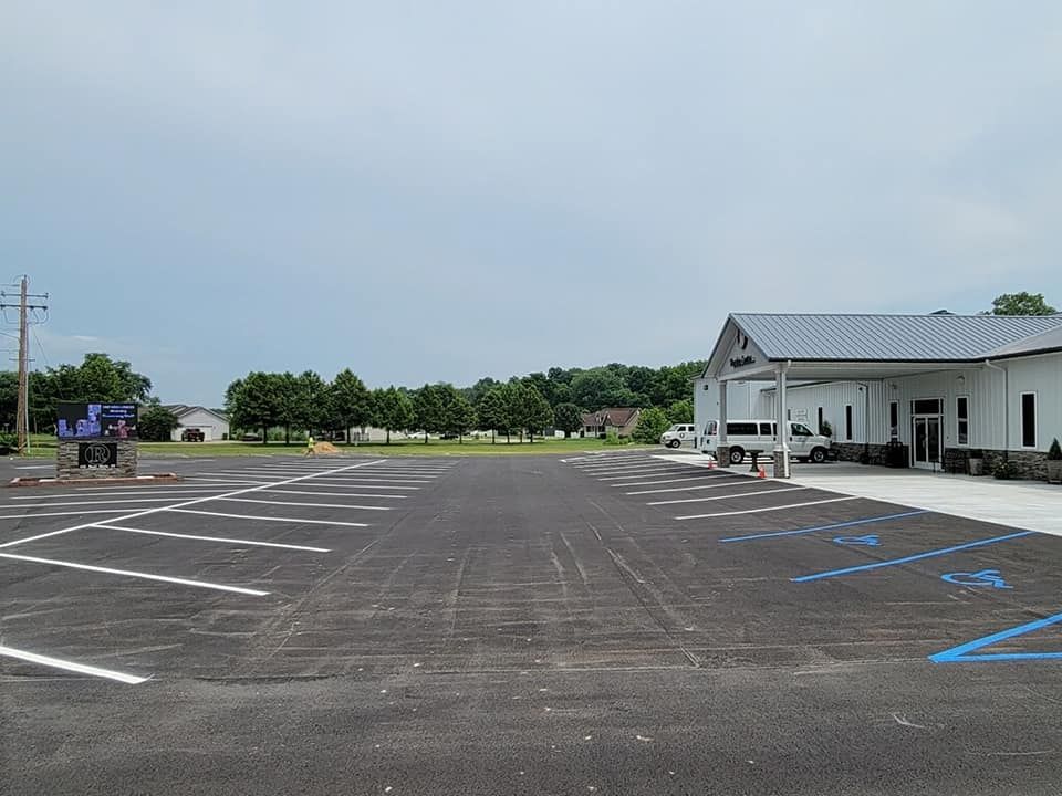 Our striping service includes professionally painting parking lot lines and markings with durable, high-quality paint to enhance the safety and organization of your property's asphalt surface. for Fine Line Striping in Jackson, MO