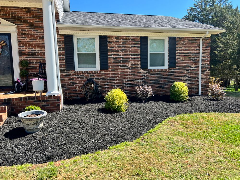 Our mulch installation service enhances your landscape's appearance, conserves soil moisture, and suppresses weeds. Enjoy a low-maintenance, vibrant outdoor space with expertly applied organic materials tailored to suit your garden's needs. for Massey Landscaping in Gastonia, NC