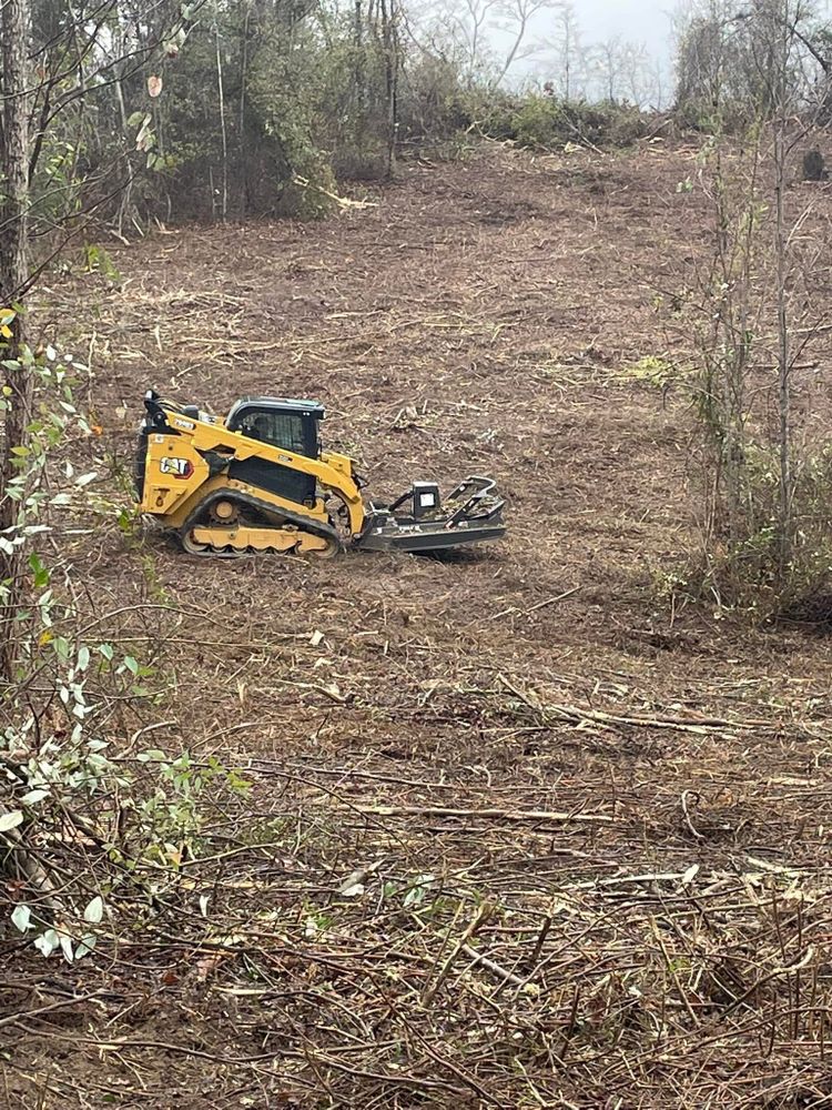 Our Forestry Mulching service efficiently clears overgrown land, turning unwanted vegetation into beneficial mulch. Ideal for site preparation and landscape enhancement, it promotes healthy soil while minimizing environmental impact and preserving desirable trees. for DC Construction Company LLC in Clanton, AL