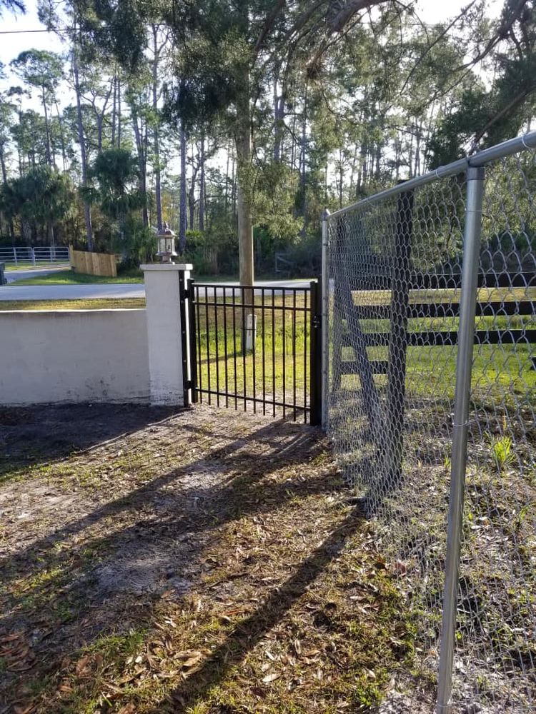 Enhance your property's beauty and security with our expert fence installation services, seamlessly integrated with mulch installation to ensure a cohesive, attractive landscape that prioritizes both aesthetics and functionality. for Nick of Time Tree Service in North Port, FL
