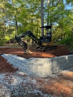 Our Dirtwork service expertly addresses grading, excavation, and soil preparation needs, ensuring a solid foundation for beautiful landscaping while enhancing drainage systems to protect your home and enhance outdoor aesthetics. for J&J Hauling and Outdoor in Fayetteville, GA
