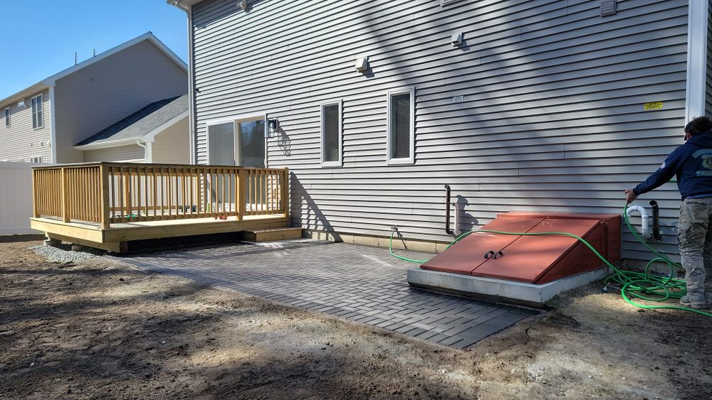 Enhance your outdoor living space with our expert Patio Design & Construction service. We create beautiful, durable patios that perfectly complement your landscape, adding value and enjoyment to your home. for Romero Máster Landscaping in Lunenburg, MA