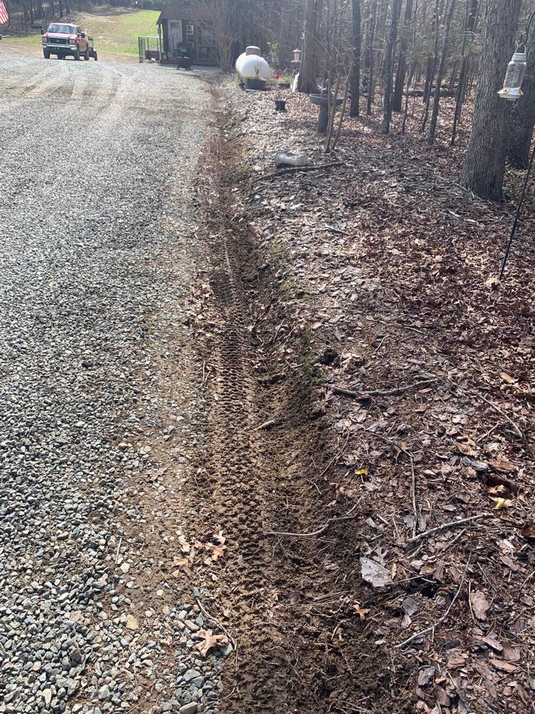 Discover our land grading service, an essential step in creating a level foundation for construction. Learn what is land clearing as we expertly prepare your site for optimal building conditions. for AJ Miles in Siler City, NC