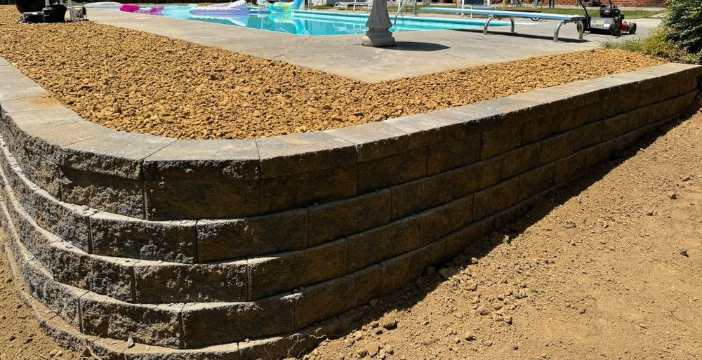 Our Retaining Wall Construction service offers durable, expertly crafted walls that enhance your property's landscape, prevent soil erosion, and add aesthetic value. Trust our skilled team to ensure stability and beauty for your home. for Southeast Land Services in Cleveland, TN