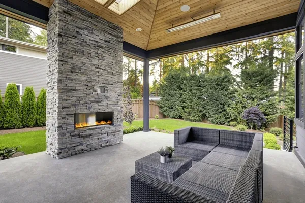 Transform your backyard into a cozy gathering space with our Outdoor Fireplaces service. Our expert masons will design and build a custom fireplace to enhance your outdoor living experience. for Select Masonry & Roofing in Framingham, MA