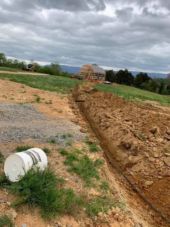 Our trenching service expertly digs precise, narrow trenches for utilities, drainage systems, or landscaping projects. Trust us to safely and efficiently prepare your property while minimizing disruption to your daily life. for Wirt Construction in Greeneville, TN