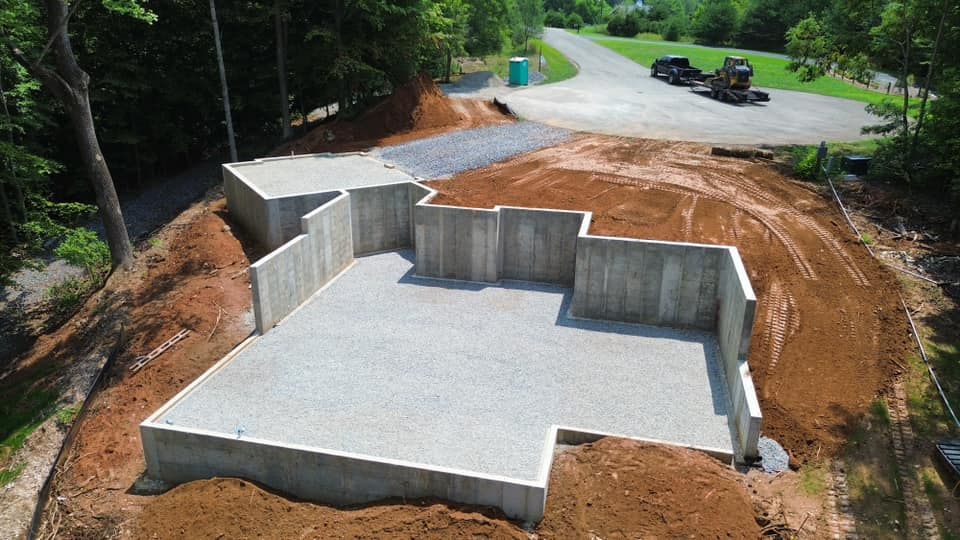 Our Foundation Backfilling service involves filling the space around a foundation with gravel and/or soil to provide structural support and prevent moisture issues, ensuring the longevity of your home's foundation. for Lanier Excavating LLC in Bedford County, VA