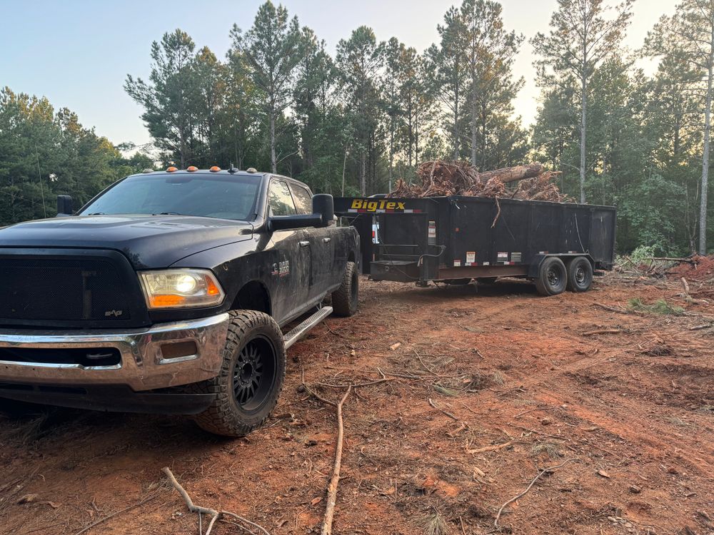 Our Debris Removal service efficiently clears construction waste, yard debris, and unwanted materials, ensuring a clean site. We prioritize safety and eco-friendly disposal methods for residential properties of all sizes. for Under Grace Transport and Grading in Marble Hill, GA