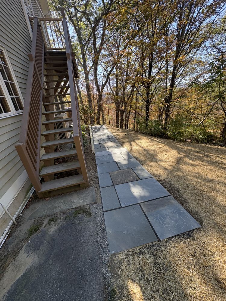 Enhance your home's outdoor appeal with our expert patio design & construction services, offering customized walkway solutions that seamlessly blend aesthetics and functionality for a welcoming and durable landscape. for Thomas Clifford Property Services LLC in Enfield, NH