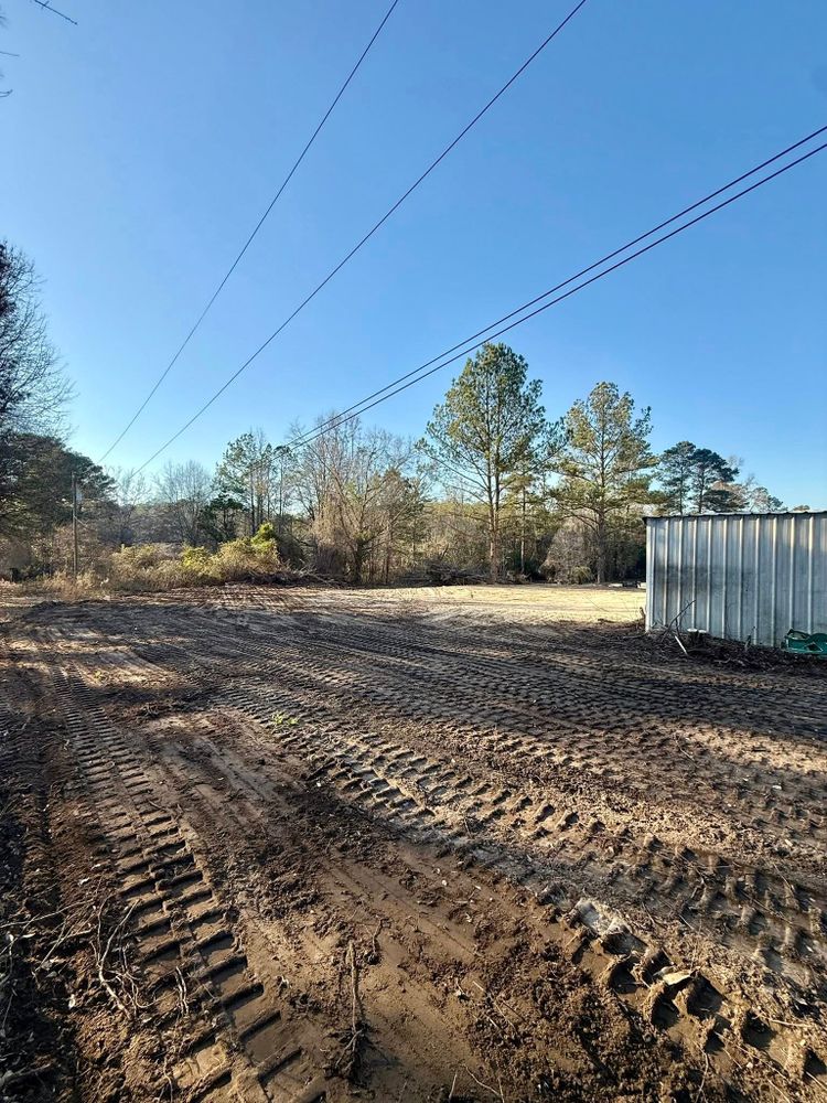 Our Site Grading service ensures your property is perfectly leveled for construction, improving drainage and stability. Trust our experts to create a solid foundation for your home or landscaping project. for Iron Pine Land & Grading in Harris County,  GA