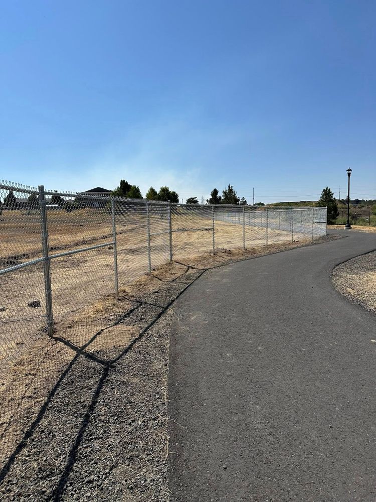 Our Chain-Link service provides homeowners with durable, cost-effective fencing solutions that offer security and visibility, ideal for protecting your property while maintaining an open feel for gardens or yards. for Double RR Construction in Madras, OR