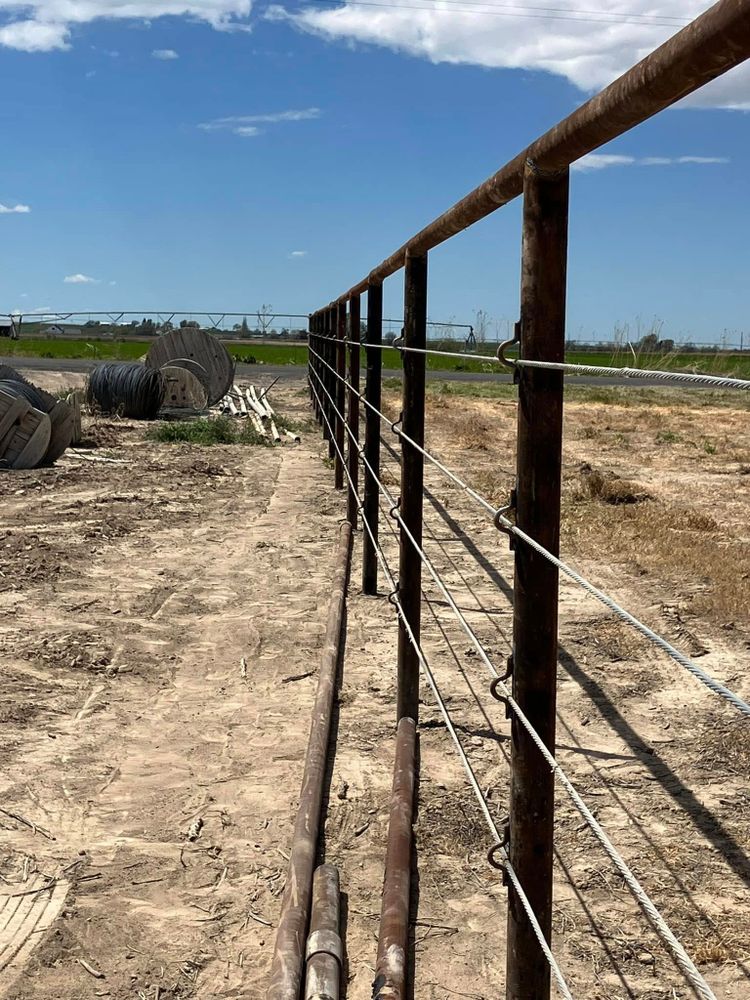 Protect your property and livestock with our durable agricultural fencing, expertly welded for strength, security, and longevity. We design and install reliable fencing solutions tailored to your land and needs. for TK Welding Services in Castleford, ID
