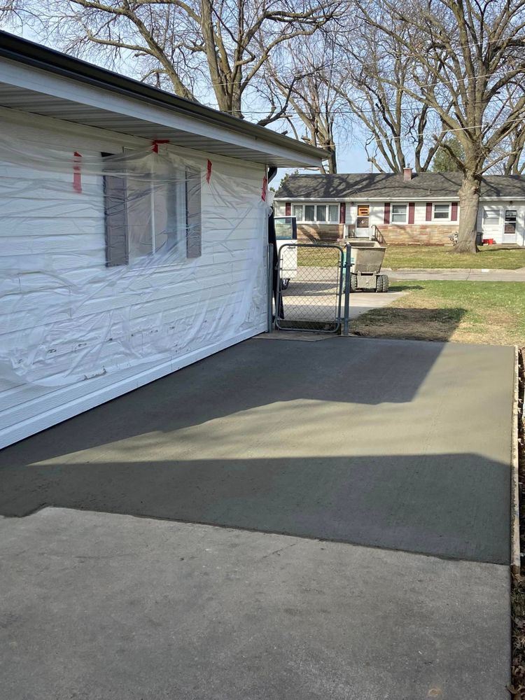 Our Concrete service offers homeowners high-quality and durable concrete solutions for their driveways, patios, walkways, and other outdoor spaces to enhance the beauty and functionality of their homes. for Sly Construction LLC in Newton, IA