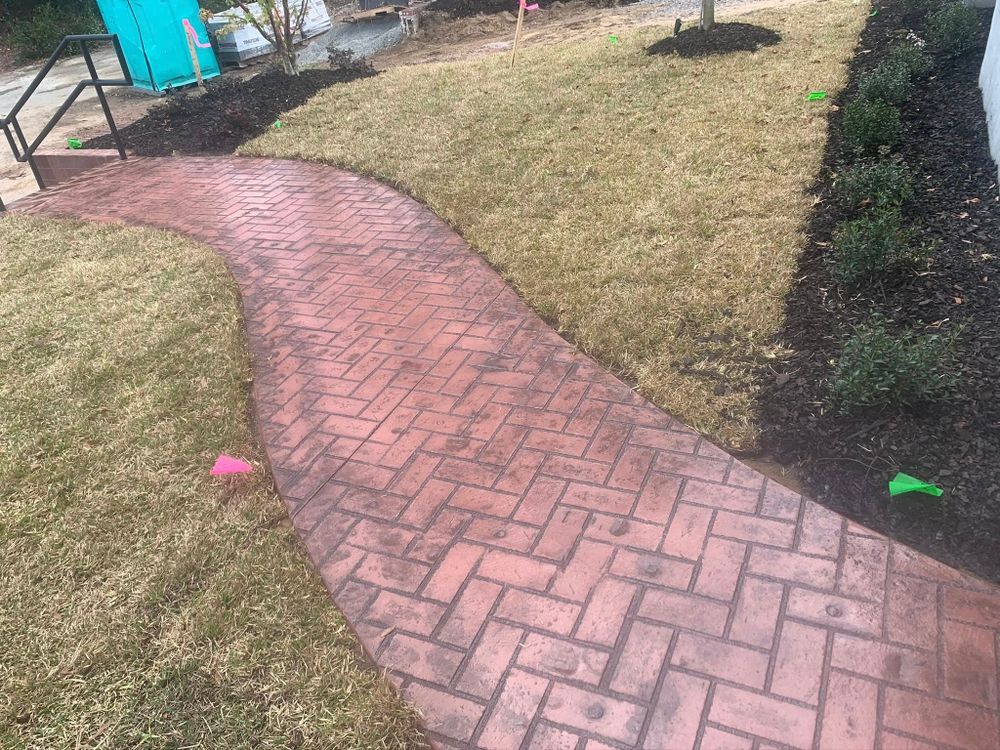 Our expert Sidewalk Installation service ensures durable and aesthetically pleasing pathways that enhance your home's curb appeal while providing safe, reliable access for everyday use. Quality craftsmanship tailored to fit your needs. for Fichter Concrete in North Charleston, SC