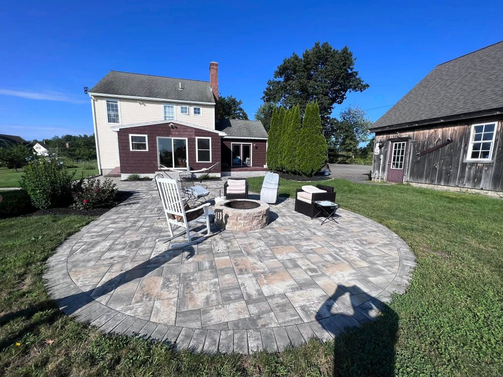 Enhance your outdoor space with our Patio Design & Construction service. We create beautiful, durable patios tailored to your style and needs, ensuring quality craftsmanship for a perfect backyard oasis. for Bradleyworx in Troy, NH