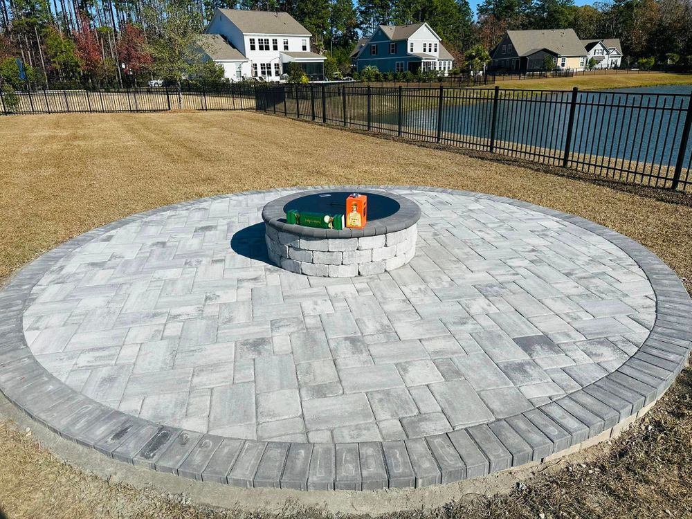 Transform your outdoor space with our custom Fireplaces service. Create a cozy and inviting atmosphere for gatherings or relaxation in your backyard while adding value to your home. Contact us today! for George’s Hardscape  in Bluffton, SC