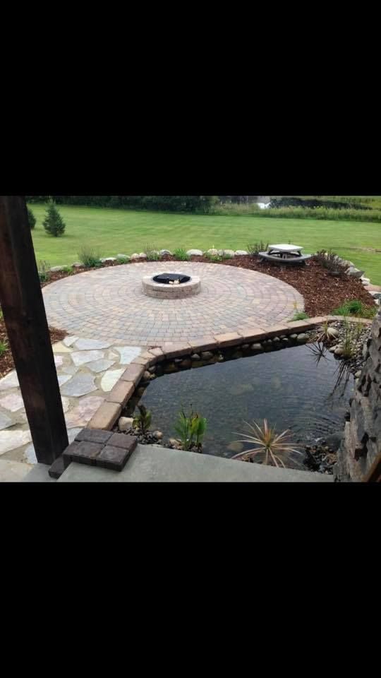 Enhance your outdoor space with our Water Ponds service, offering custom-designed ponds that add tranquility and beauty to your landscape while supporting local wildlife and creating a serene garden oasis. for Titan Landscaping in Rosemount, MN