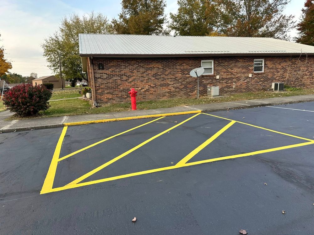 Enhance your driveway's appearance and safety with our professional striping service. We provide precise line markings to ensure clear boundaries and a polished finish for a functional and attractive outdoor space. for Heady Seal Coating in Sturgis, KY