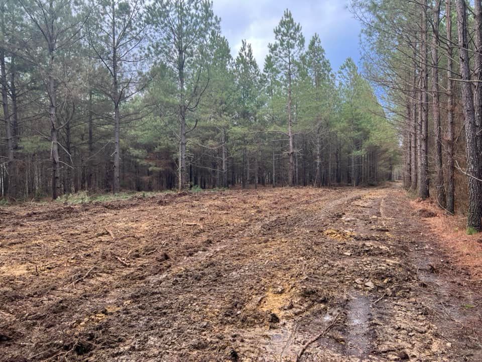 Our Land Grading service ensures a smooth, level foundation for your project by expertly reshaping the land to promote proper drainage and enhance overall landscape design, increasing stability and curb appeal. for Mountain Land Services LLC. in Oneida, TN
