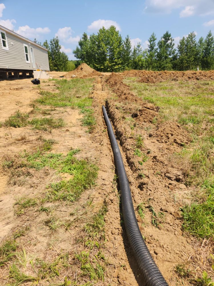 Our Drainage System Install & Repair service ensures effective water management, preventing flooding and protecting your property's foundation. We provide expert assessment, installation, and maintenance for optimal drainage performance tailored to your home's needs. for West TN Dirt Works in Lexington, TN