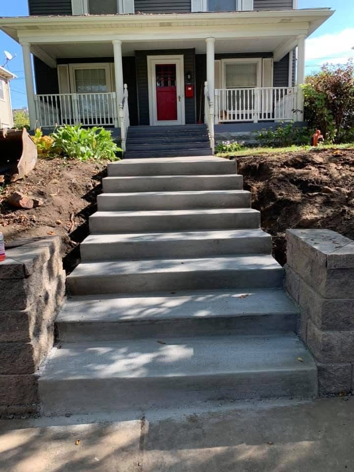 Our Traditional Broom Finished Concrete service offers durable and visually appealing concrete of any size including driveways, patios, walkways, aprons, and so much more to enhance the functionality and aesthetic appeal of your home's exterior. for Outdoor Dynamics LLC in Sherburne County, MN