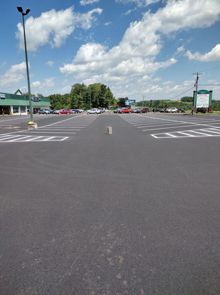 Enhance your home's curb appeal with our professional driveway paving service, offering durable and smooth asphalt solutions tailored to withstand any weather while providing a polished, attractive entrance to your property. for Stripe A Lot in Knoxville, TN