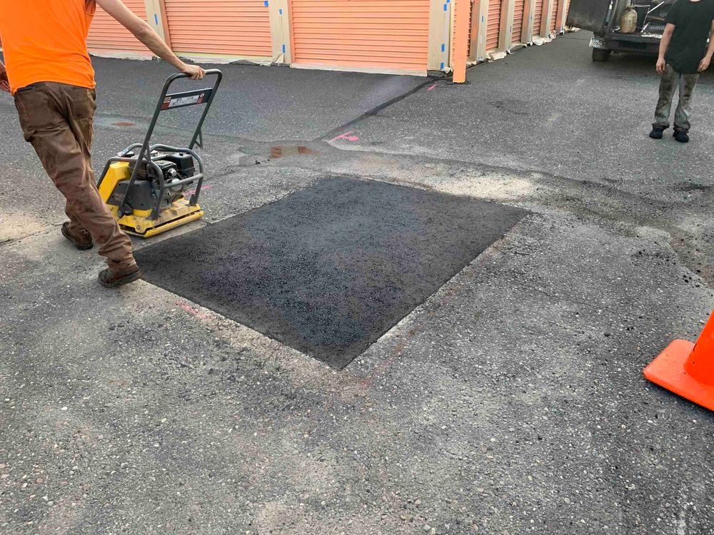 Our Patching service expertly repairs damaged asphalt, ensuring a smooth, durable surface. Trust us to extend your pavement's lifespan with cost-effective solutions that enhance safety and curb appeal for your home. for Custom Paving in Savannah, GA