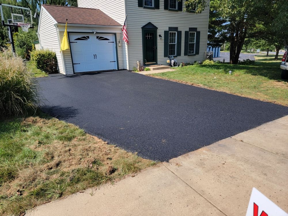 Our Asphalt Maintenance service ensures your driveway remains safe and appealing with crack sealing, patching, and sealcoating treatments to extend the pavement's lifespan while enhancing curb appeal. for Warwick Paving in Lititz, PA