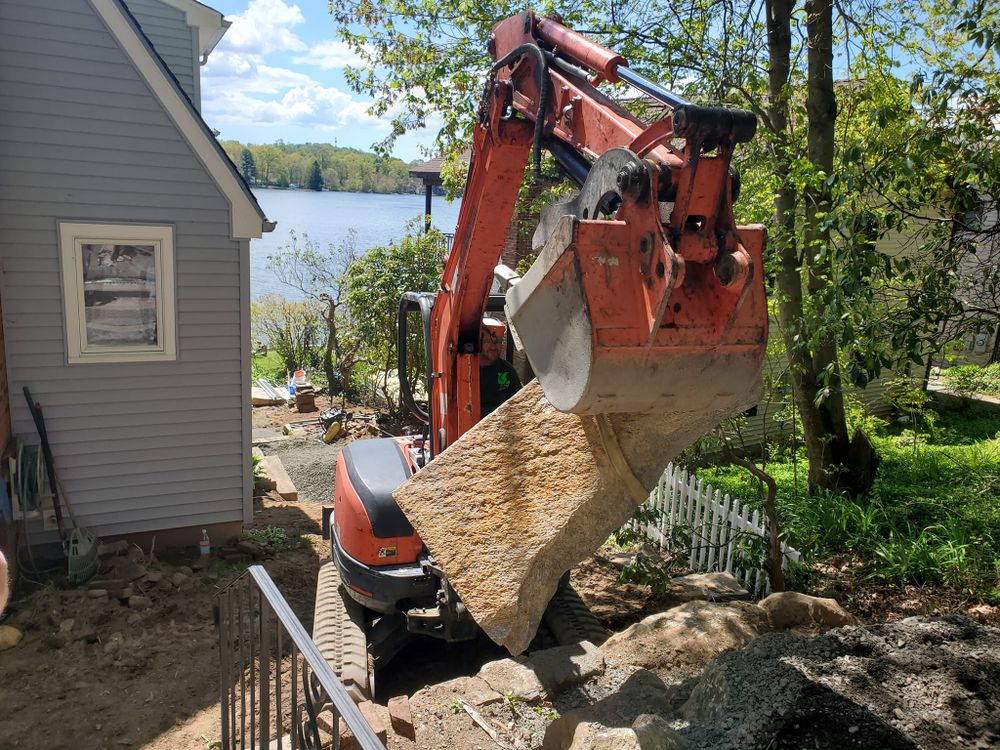 Enhance your outdoor space with our custom stonework services, offering tailored designs and expert craftsmanship to transform patios, walkways, and garden features into stunning focal points. Elevate your home's landscape today. for Evolution Earthscapes, LLC in Ludlow, MA
